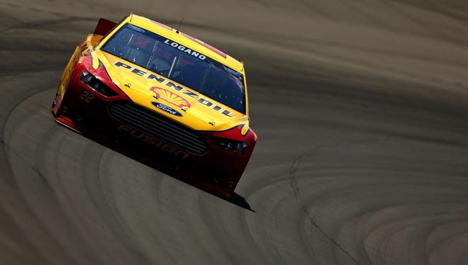 BROOKLYN, MI - AUGUST 18:  Joey Logano, driver of the #22 Shell-Pennzoil Ford, races the NASCAR Sprint Cup Series 44th Annual Pure Michigan 400 at Michigan International Speedway on August 18, 2013 in Brooklyn, Michigan.  (Photo by Mike Ehrmann/Getty Images) ORG XMIT: 159337374 ORIG FILE ID: 176754849