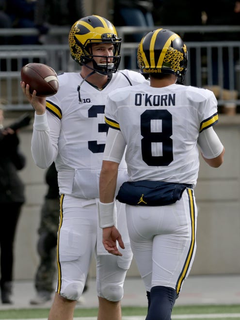 Michigan quarterbacks John O' Korn and Wilton Speight warm-up before playing Ohio State at Ohio Stadium in Columbus, Ohio on Saturday, Nov. 26, 2016.