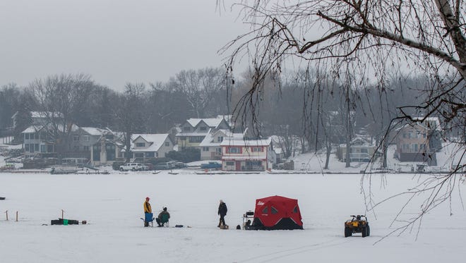 Ice fishermen set up camp on Okauchee Lake during a 2016 fisheree. Department of Natural Resources conservation warden supervisor Rick Reed cautions that "there is no such thing as safe ice."
