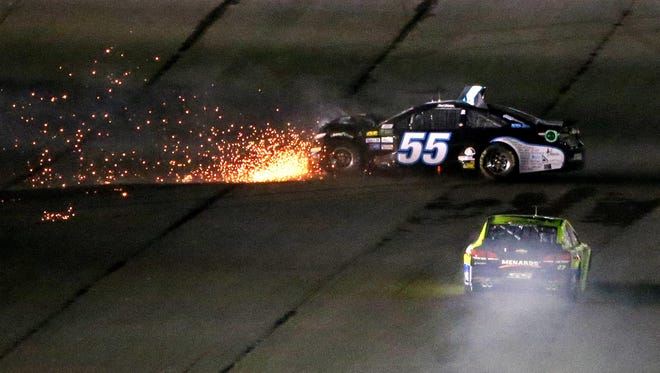 DUEL 1: Reed Sorenson (55) and Paul Menard (27) wreck. Sorenson was unable to finish the race.