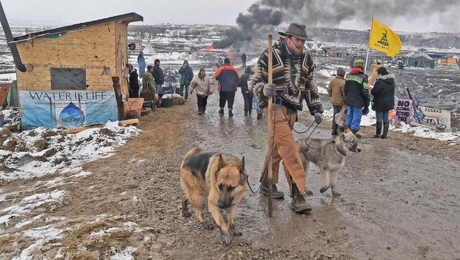 Jasper Spillman, of Lawrence, Kan., leaves the protest camp at the Dakota Access pipeline near Cannon Ball, N.D. Most of the pipeline opponents abandoned their protest camp ahead of a government deadline to get off the federal land, and authorities moved to arrest some who defied the order in a final show of dissent.