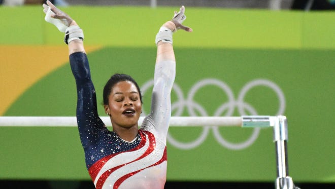 Gabby Douglas (USA) competes during the women's team finals in the Rio 2016 Summer Olympic Games at Rio Olympic Arena.