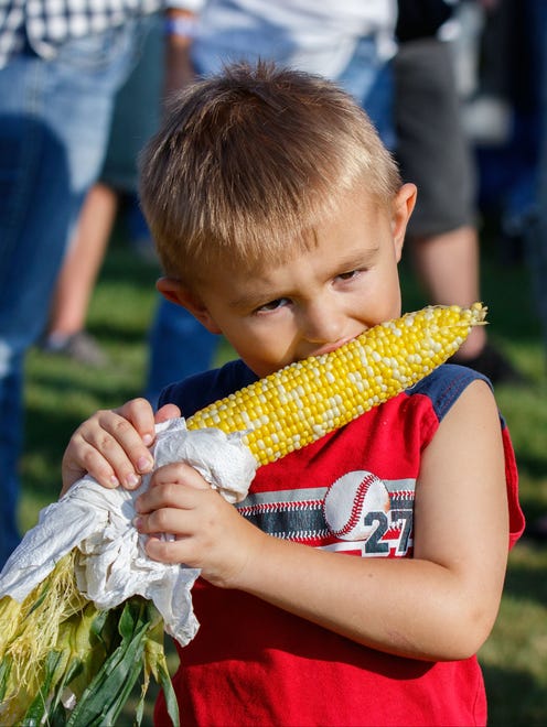 Four-year-old Tristan Buske of Ixonia enjoys a cob of sweet corn during the annual Ixonia Town and Country Days Festival hosted by the Ixonia Lions Club on Saturday, August 19, 2017.