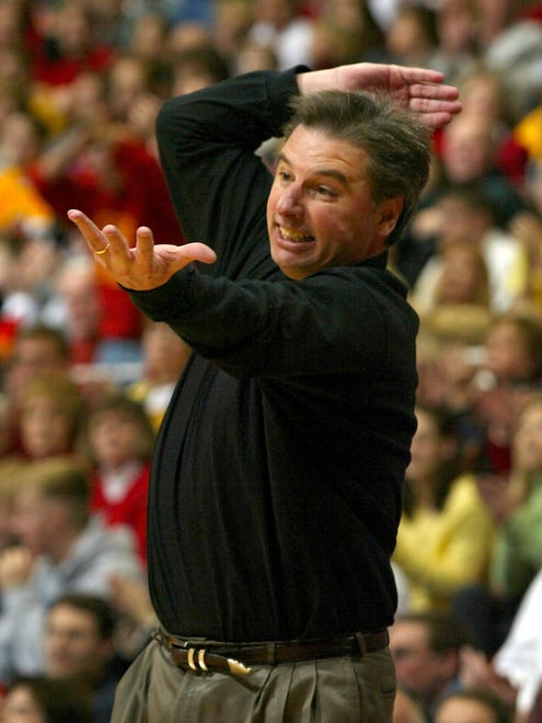 Iowa State Coach Larry Eustachy get wound up as the game gets tight. ISU in white defeats Kansas State, 64-61, at Ames.