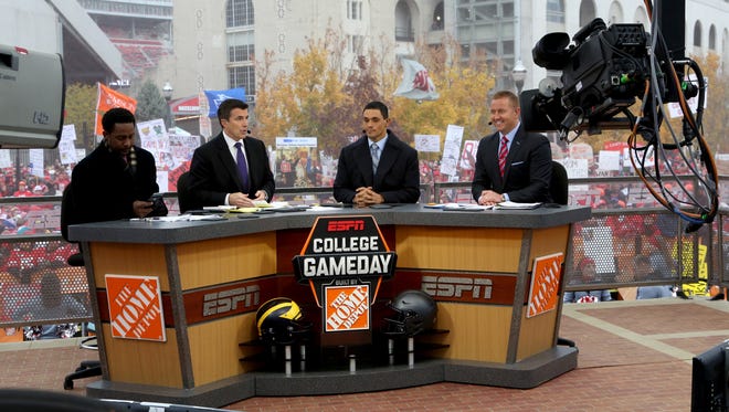 The crew of ESPN "College GameDay" talks before the game between Michigan and Ohio State at Ohio Stadium in Columbus on Saturday, November 26, 2016.