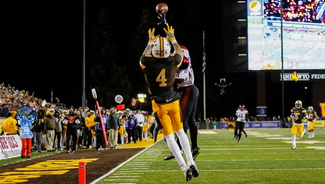 Wyoming wide receiver Tanner Gentry (4) catches a touchdown pass against San Diego State.