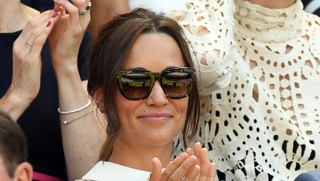 Pippa Middleton sit in the Royal Box on Centre Court.
