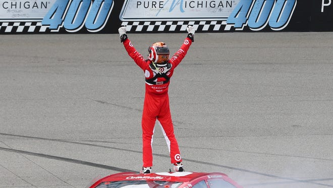 Kyle Larson celebrates his first career NASCAR Sprint Cup Series win, Sunday at Michigan International Speedway.