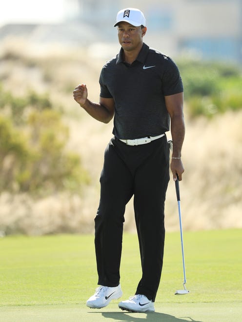 Tiger Woods fires off a fist pump after a birdie at No. 8 during the first round of the Hero World Challenge in Nassau, Bahamas.
