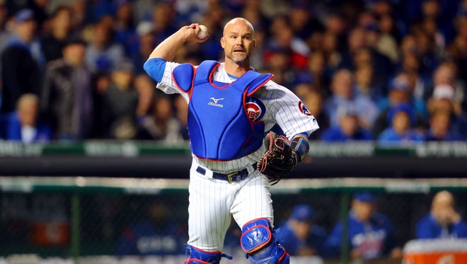 Game 1 in Chicago: Cubs catcher David Ross throws to first base for an out during the second inning.