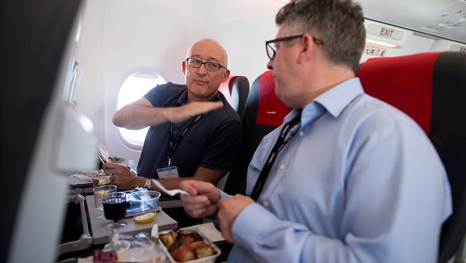 Passengers aboard the flight, most of whom bid to win tickets in a charity auction, relax aboard a Norwegian Air Boeing 737 MAX delivery flight en route to Oslo, Norway, on June 29, 2017.