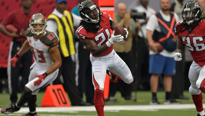 Atlanta Falcons cornerback Desmond Trufant (21) intercepts a pass against the Tampa Bay Buccaneers during the first half at the Georgia Dome.