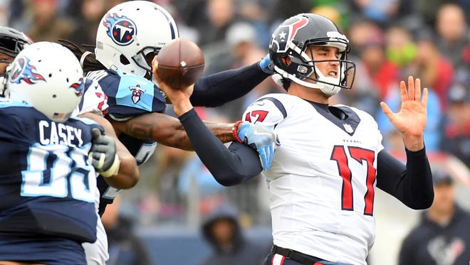 Houston Texans quarterback Brock Osweiler (17) is sacked in the first half by Tennessee Titans safety Daimion Stafford (24) at Nissan Stadium.