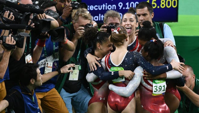Aly Raisman (USA) and her teammates react during the women's team finals in the Rio 2016 Summer Olympic Games at Rio Olympic Arena.