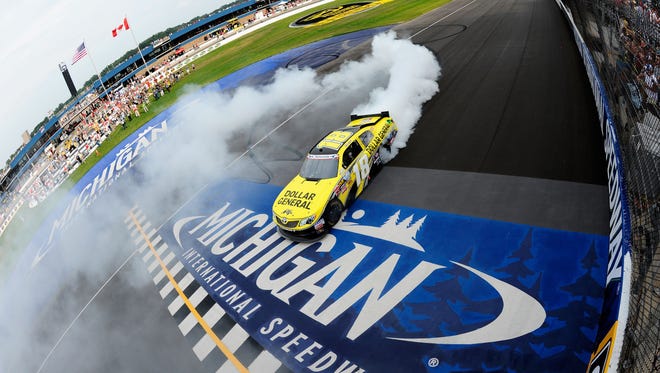 ORG XMIT: 146460756 BROOKLYN, MI - JUNE 16:  Joey Logano, driver of the #18 Dollar General Toyota, celebrates his win with a burnout after the NASCAR Nationwide Series Alliance Truck Parts 250 at Michigan International Speedway on June 16, 2012 in Brooklyn, Michigan.  (Photo by Jared C. Tilton/Getty Images) ORIG FILE ID: 146448338