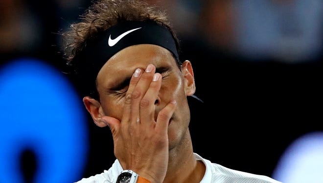 Spain's Rafael Nadal reacts to a lost point while playing Canada's Milos Raonic during their quarterfinal at the Australian Open on Jan. 25.