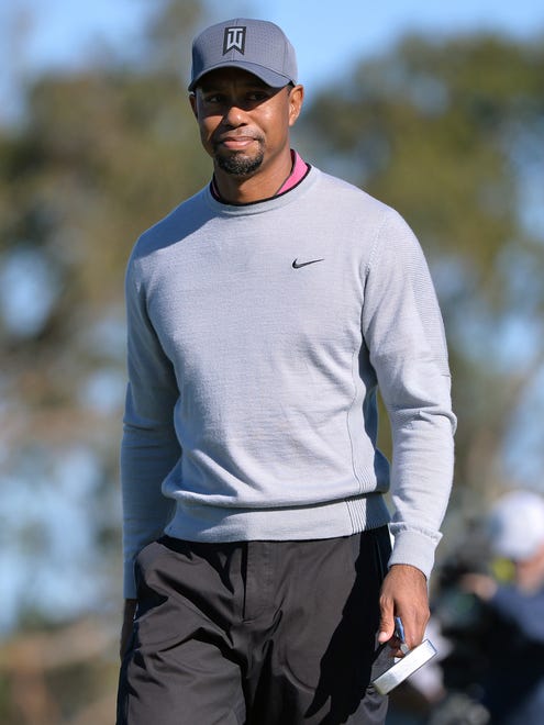 Tiger Woods walks off the 10th green following a putt during the second round of the Farmers Insurance Open golf tournament at Torrey Pines Municipal Golf Course - North Co.