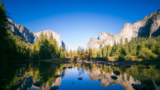 California: Dramatic granite mountains, plummeting waterfalls and immense sequoias characterize Yosemite National Park ($30 per vehicle), making it a must-see bucket list destination for the state. If you don't make it during the summer, visit during the last two weeks of February to see one of the most breathtaking sights: Horsetail Falls blazes as if made from liquid fire when the last rays of setting sun reflect on it. The event draws large crowds, so plan to spend the day in the area to see the sunset. 
If you're a fan of "The Shining," you might experience a little deja vu when you walk into the Majestic Yosemite Hotel, formerly known as The Ahwahnee Hotel. Its lounge was the inspiration for the Colorado Lounge in the movie and the chandeliers, fireplace and windows are nearly identical.
