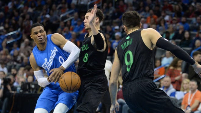 Thunder guard Russell Westbrook (0) is fouled by Timberwolves guard Zach LaVine (8) during the fourth quarter.