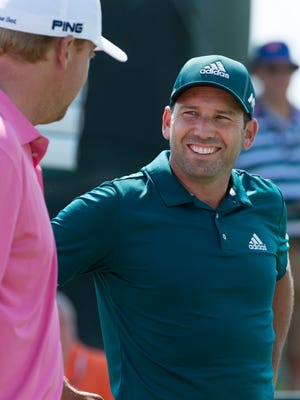 Sergio Garcia (right) socializes while waiting to tee  off on the 10th hole during a U.S. Open practice round Tuesday.