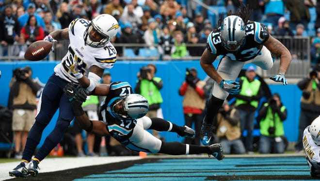 San Diego Chargers cornerback Casey Hayward (26) breaks up a pass in the end zone intended for Carolina Panthers wide receiver Devin Funchess (17) as wide receiver Kelvin Benjamin (13) looks on in the first quarter at Bank of America Stadium.