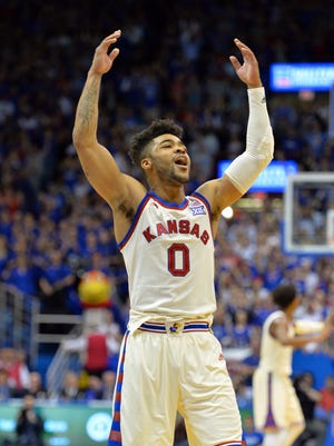Kansas Jayhawks guard Frank Mason III (0) motions to the crowd in overtime against the West Virginia Mountaineers at Allen Fieldhouse. Kansas won 84-80.