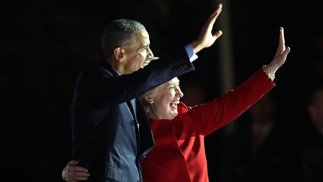Obama and Clinton wave to the crowd during an election eve rally on Nov. 7, 2016, in Philadelphia.