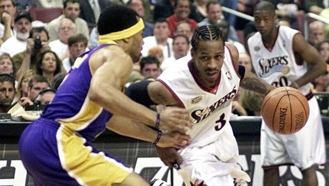 Allen Iverson is guarded by Derek Fisher in the first quarter as the 76ers hosted the Lakers in Game 4  of the NBA Finals.