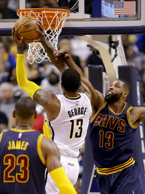 Indiana Pacers forward Paul George (13) is fouled by Cleveland Cavaliers center Tristan Thompson (13) in the second half of their NBA playoff basketball game Sunday, April 23, 2017, afternoon at Bankers Life Fieldhouse. The Pacers lost to the Cavaliers 106-102.