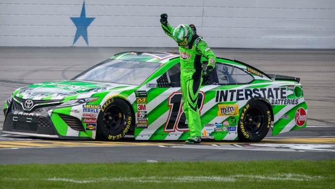 Kyle Busch celebrates after winning the spring race at Texas Motor Speedway for his first victory of 2018 and the 44th overall in his Cup Series career, tying Bill Elliott for 16th-place all time.