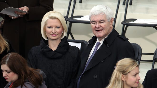 Former Speaker of the House Newt Gingrich and his wife Callista Gingrich arrive for the presidential inauguration.