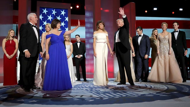 U.S. President Donald Trump, first lady Melania Trump, U.S. Vice President Mike Pence, his wife Karen Pence and their families dance during the inaugural Liberty Ball at the Washington Convention Center in Washington.