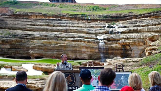 Bass Pro Shops founder and CEO Johnny Morris talks to attendees during a press event announcing a new golf course designed by Tiger Woods with the support of Johnny Morris in Hollister, Mo. on April 18, 2017.