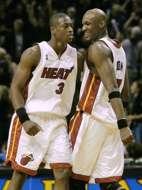 Miami Heat's Lamar Odom and Dwayne Wade celebrate their win against the New Orleans Hornets in Game 1 of their NBA first-round playoff series at the American Airlines Arena. (Apr 2004)