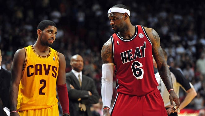 2013: Kyrie Irving looks over at LeBron James.