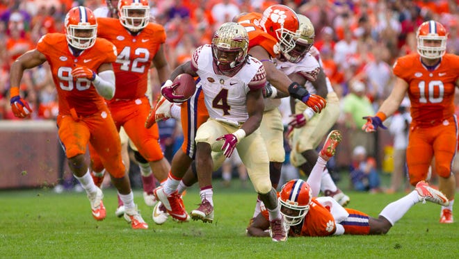 Florida State  running back Dalvin Cook breaks free from the Clemson defense during their game in 2015.