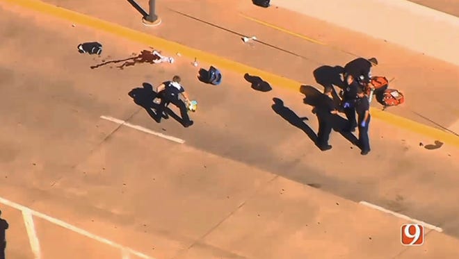 This still image taken from an aerial video provided by KWTV shows police responding to a shooting at Will Rogers World Airport in Oklahoma City on Tuesday