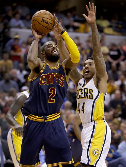 Cleveland Cavaliers guard Kyrie Irving (2) drives by Indiana Pacers guard Jeff Teague (44) in the second half of their NBA playoff basketball game Sunday, April 23, 2017, afternoon at Bankers Life Fieldhouse. The Pacers lost to the Cavaliers 106-102.