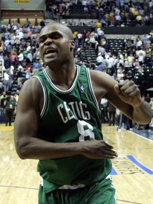 2005: Antoine Walker celebrates as he leaves the court following a 93-89 overtime win against the Indiana Pacers.