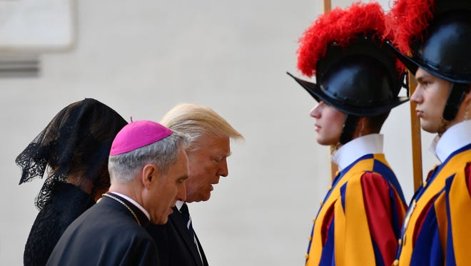 President Trump and his wife Melania are welcomed by the prefect of the papal household Georg Gaenswein at the Vatican on May 24, 2017.