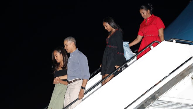 The Obama family arrives on Air Force One on Dec. 16, 2016, at Joint Base Pearl Harbor-Hickam, adjacent to Honolulu, Hawaii, for their annual family vacation on the island of Oahu.