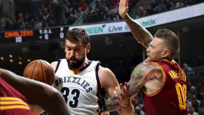Memphis Grizzlies Marc Gasol drives to the basket against the defense of  the Cleveland Cavaliers' Chris Andersen.