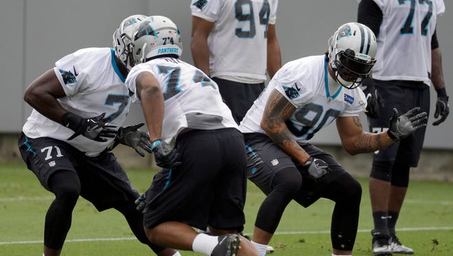 Carolina Panthers defensive end Julius Peppers, right, runs a drill during the NFL football team's minicamp in Charlotte, N.C., Tuesday, June 13, 2017.
