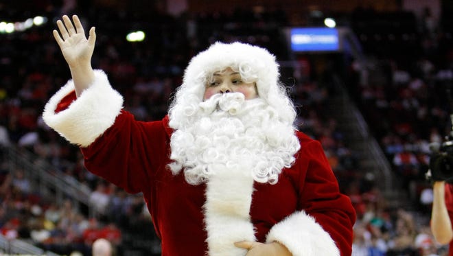 Santa Claus makes an appearance at a game between the Houston Rockets and Memphis Grizzlies in the fourth quarter at the Toyota Center.