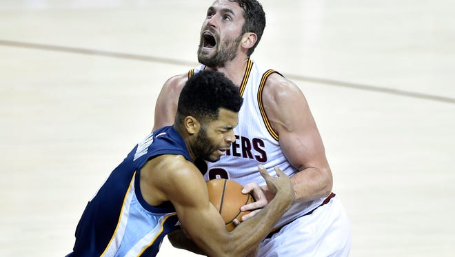 Dec 13, 2016; Cleveland, OH, USA; Cleveland Cavaliers forward Kevin Love (0) drives against Memphis Grizzlies guard Andrew Harrison (5) in the first quarter at Quicken Loans Arena. Mandatory Credit: David Richard-USA TODAY Sports