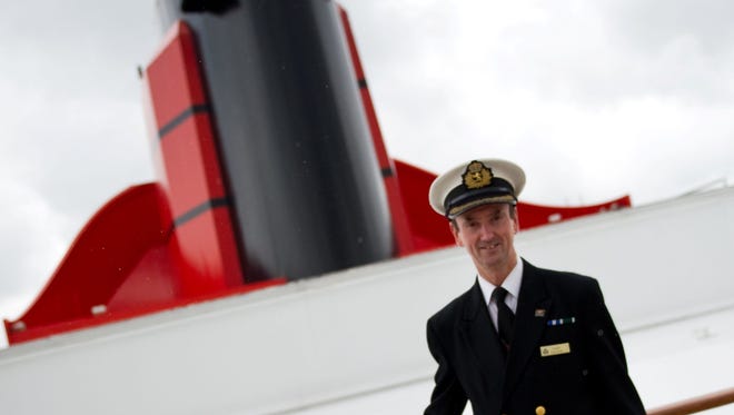 The captain of the Queen Mary 2, Christopher Wells, atop the vessel.