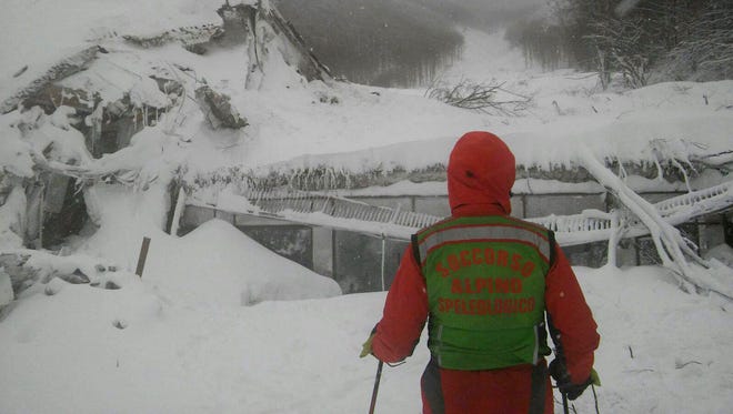 Rescue continues at hotel Rigopiano after it was hit by an avalanche in Farindola Italy Jan. 19, 2017. The Hotel Rigopiano in the town of Farindola was ripped from its foundation and almost completely covered by a wall of snow and debris up to 35 feet tall, triggered by a series of earthquakes that shook the region Wednesday.