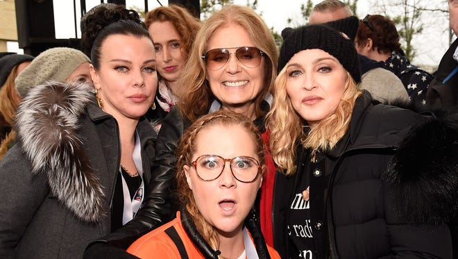Debbie Mazur, L-R back row, Gloria Steinem, Madonna  with Amy Schumer,  front, attend the rally at the Women's March on Washington.