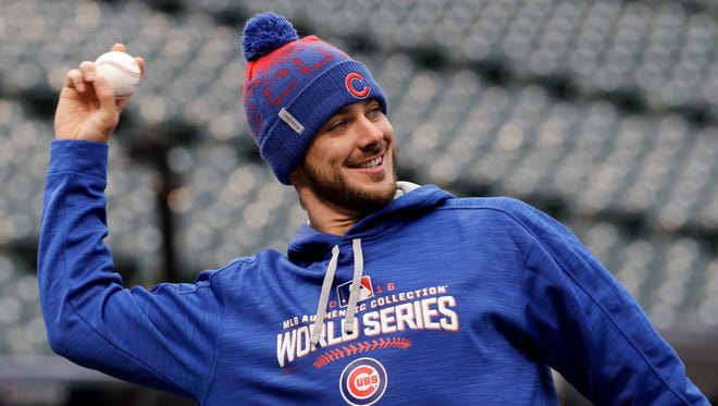 Kris Bryant warms up during a team practice on Monday.