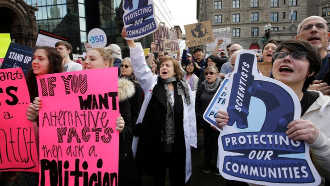 Members of the scientific community, environmental advocates and supporters demonstrate in favor of climate change research in Boston last month.